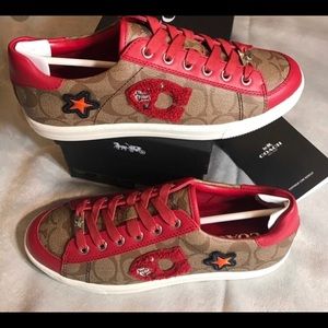Coach sneakers with red trim . Band new